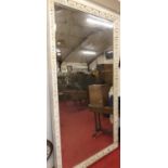 An extremely large early 20th century bevelled limed wood rectangular floor mirror, having a