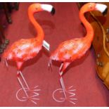 A pair of contemporary pressed metal and spray painted model standing flamingoes, height 71.5cm