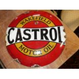 A convex enamel advertising sign for Castrol motor oil, dia.30cm