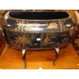 A contemporary black lacquered and gilt decorated planter by Theodore Alexander, of shouldered