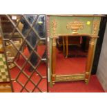 A reproduction moulded gilt composition framed wall mirror, 76 x 50cm; together with an iron and