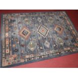 A Turkish style European manufactured machine-made blue ground rug, 194 x 137cm