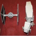 Two Star Wars modern release spaceships, being AT-AT Walker, and Darth Vader's Tie FighterNo