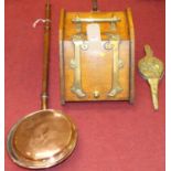 A late Victorian oak and brass bound coal purdonium, together with a small pair of bellows and a