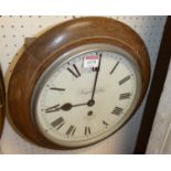 An oak cased circular wall clock, the white enamel dial signed Knight & Gibbins London, single