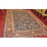 A large Persian woollen blue ground Tabriz rug, having trailing tramline borders, 395 x 312cm