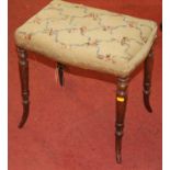 A 19th century rosewood and floral needlework upholstered dressing stool, raised on ring turned