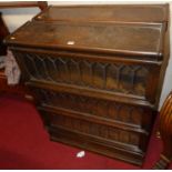 A pair of 1920s Globe Wernicke oak three-tier stacking bookcases, each having lead glazed hinged