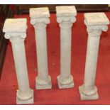 A set of four reconstituted stone Ionic columns, height 66cm