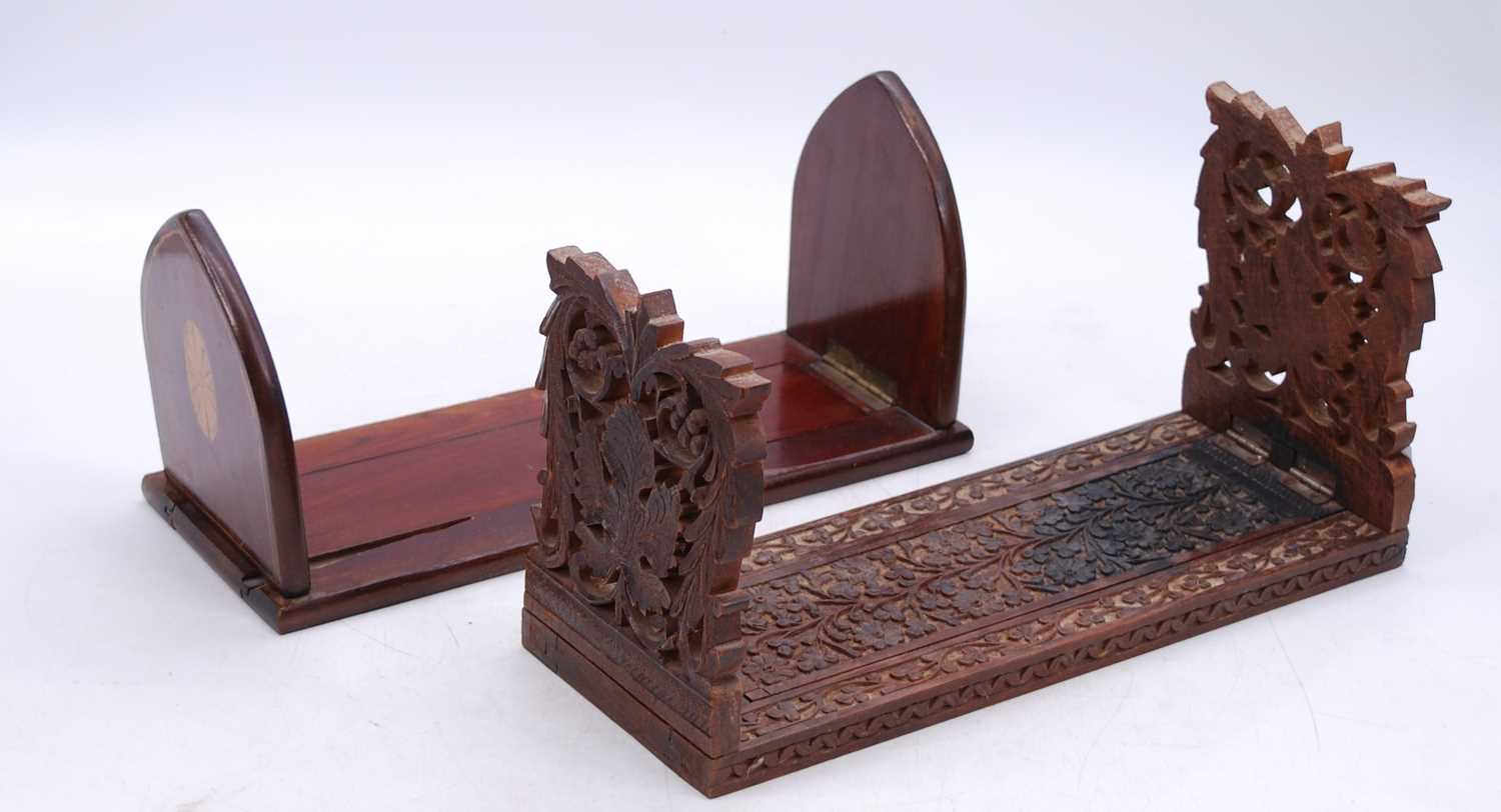 An Anglo-Indian carved hardwood bookslide, w.34cm; together with an Edwardian inlaid mahogany