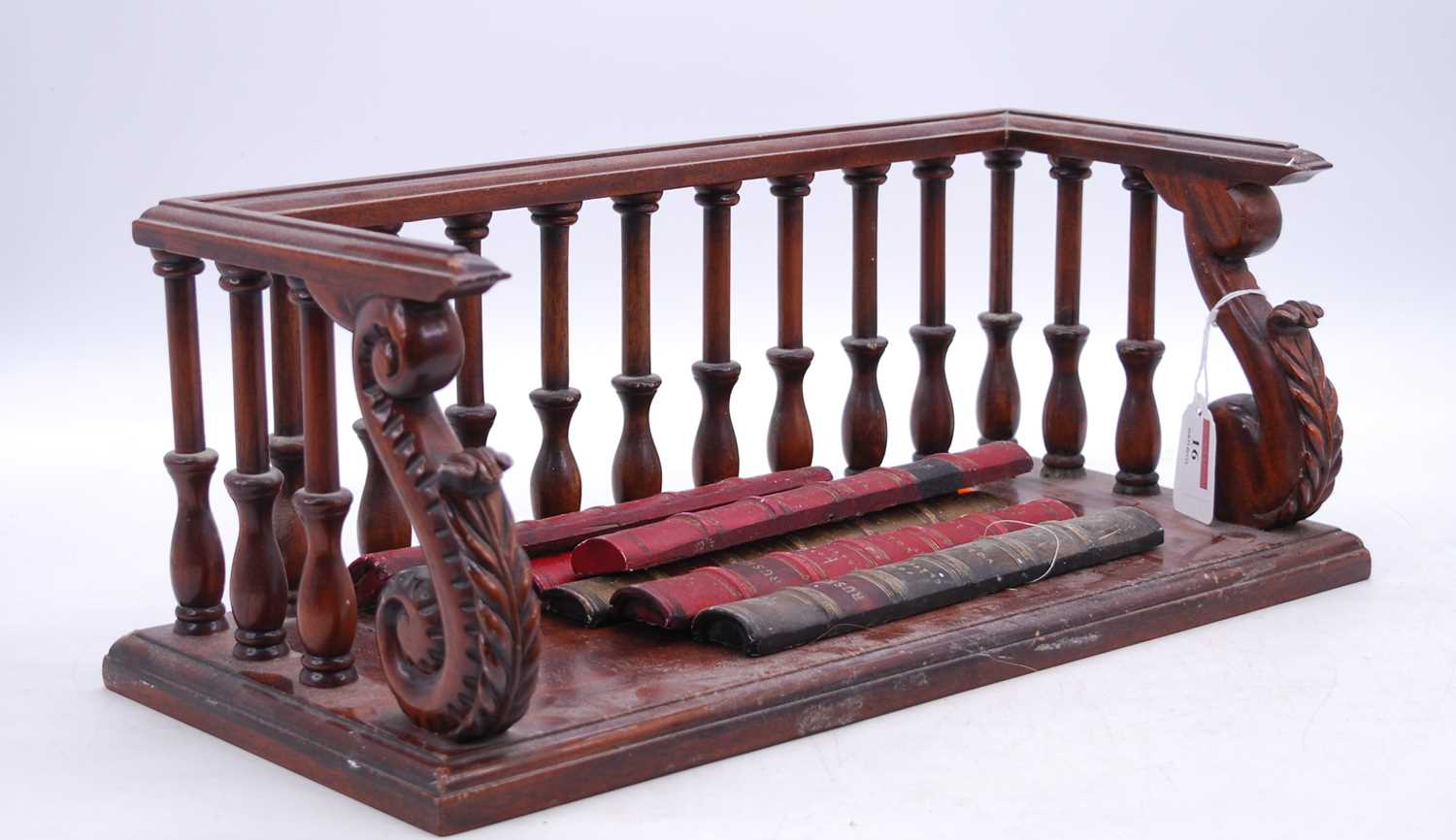 A reproduction carved mahogany book shelf, w.42.5cm