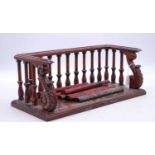 A reproduction carved mahogany book shelf, w.42.5cm