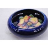 A Moorcroft Clematis pattern dish, dia.11.5cm