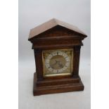 An early 20th century Winterhalder & Hofmeier oak cased mantel clock, of architectural form, the