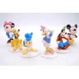 A set of four Royal Doulton Mickey Mouse Collection figures, the largest h.13cm (6)Minor scuffs