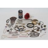 A collection of costume jewellery to include beaded bracelets, badges, quartz wrist watch etc