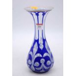 A 19th century Bohemian blue overlaid glass vase, h.24cm