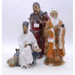 Three Chinese 'mudman' style figures of gentleman, the largest h.33cm
