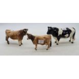 A Beswick model of a Jersey cow, model No.1345, 'Newton Tinkle', h.11cm; together with two further