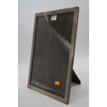 A George V silver clad easel photograph frame, Birmingham 1928, h.33.5 x 26cm