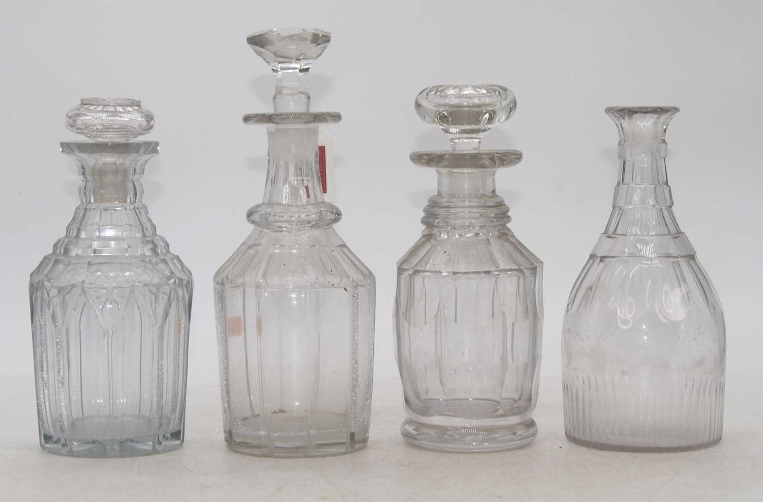 A Regency cut glass decanter, of mallet form, h.21cm; together with three other similar