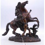 After Guillaume Coustou - a late 19th century bronze model of a Marly Horse, modelled with groom