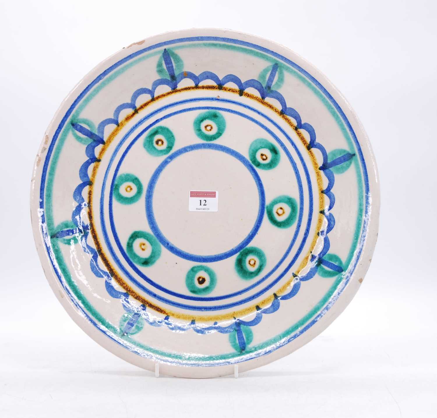 A Fratelli Piscitello polychrome decorated tin-glazed earthenware charger, dia.36cm