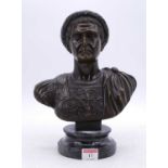 A reproduction bronzed bust of Julius Caesar, mounted upon a polished hardstone socle plinth, h.28cm