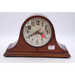 An early 20th century mahogany mantel clock, the silvered dial showing Arabic numerals, having later