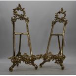 A pair of brass table easels, in the Rococo taste, h.48cmA bit loose, but useable