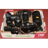 A Minolta 5000AF SLR camera, together with various other cameras and lenses