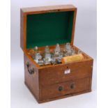A 19th century scrumble pine apothecary chest, the lid lifting to reveal an arrangement of fitted