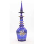 A cobalt blue glass decanter, enamel decorated with flowers, h.51cmNo damage to the decanter.