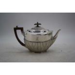 A Victorian silver teapot, of half-reeded form, London 1892, 17.2oz