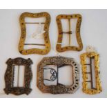 Five 19th century buckles, one being a long rectangular pinchbeck example repousse embossed with