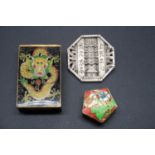 A Chinese white metal pagoda form brooch; together with a cloisonne enamelled matchbox sleeve; and