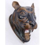 An Eastern brass model of a tigers head, h.28cm