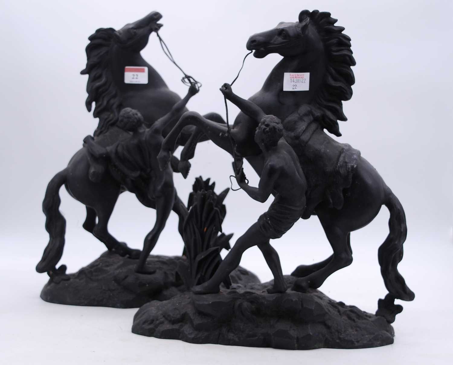 A pair of spelter models of the Marly Horses, h.39cm