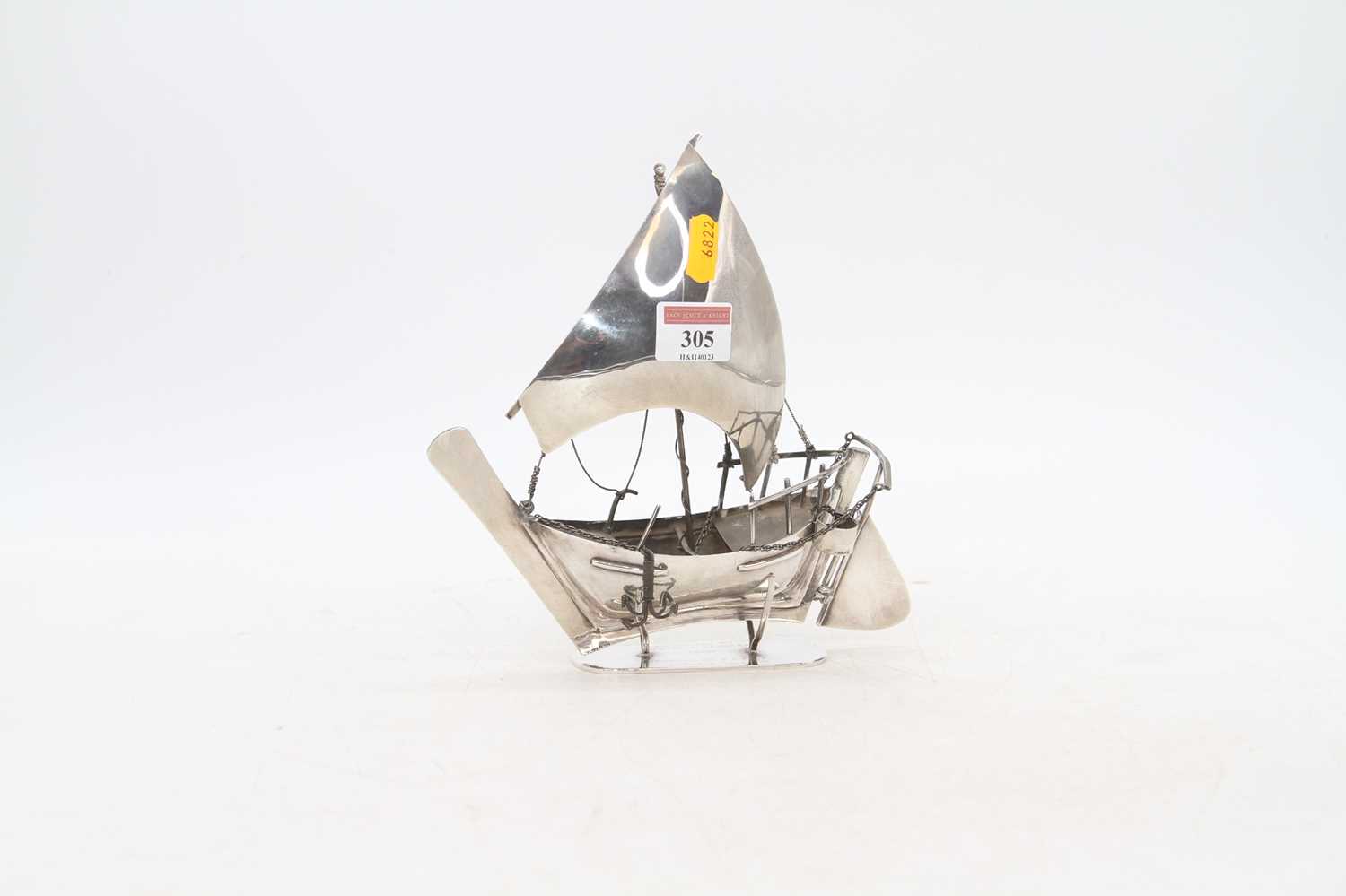 An Arabian white metal model of a dhow boat, mounted upon a presentation stand, stamped silver to - Bild 2 aus 5