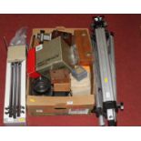 A collection of vintage photography equipment, to include tripods, lens, auto bellows etc