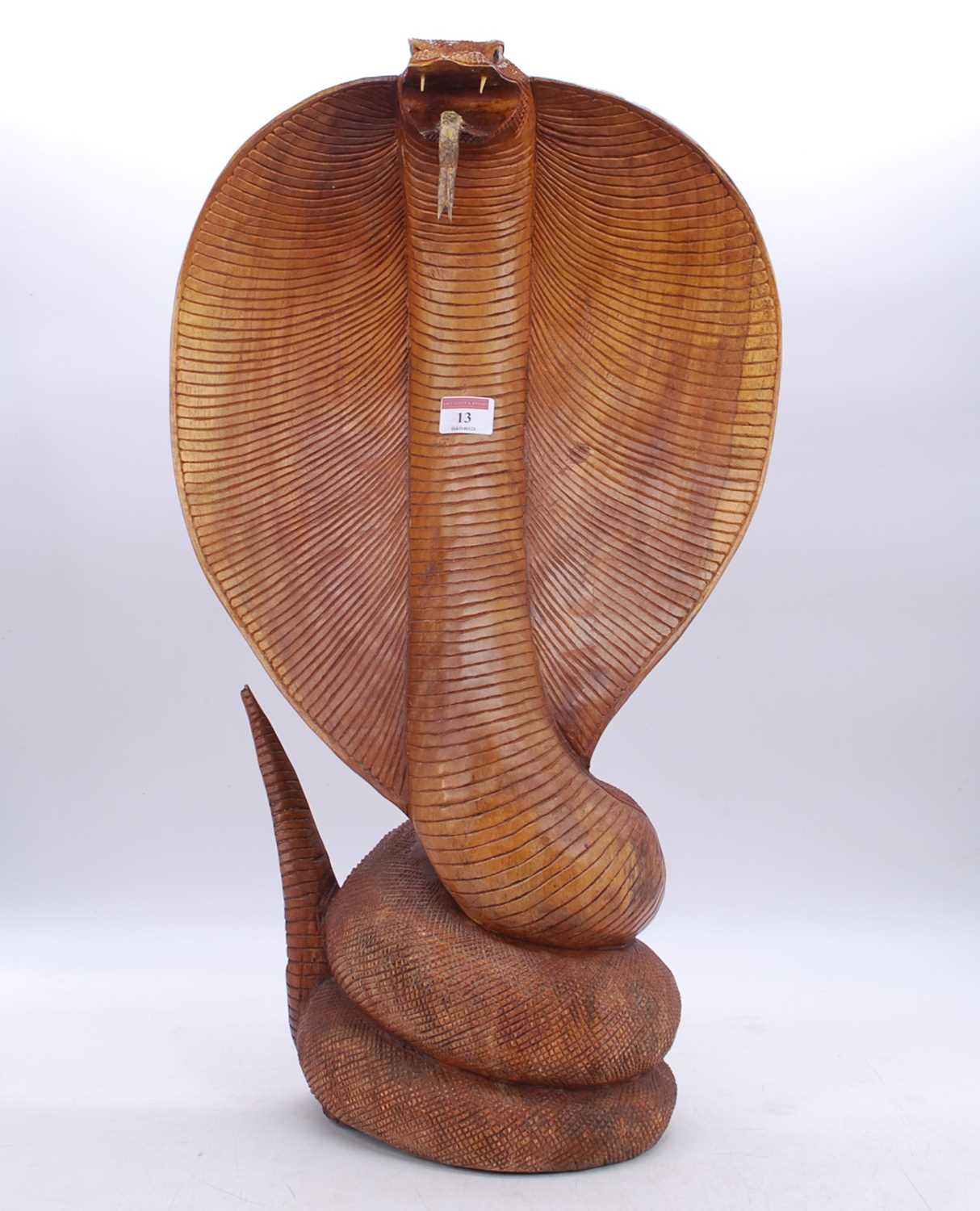 A 20th century carved hardwood model of a cobra, h.62cm
