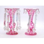 A pair of 19th century ruby overlaid glass table lustres, h.22cm