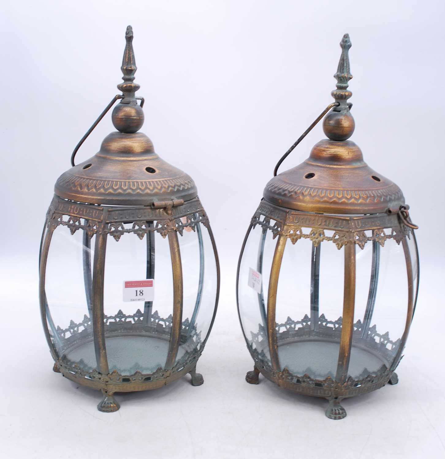 A pair of modern bronzed metal hanging lanterns, h.39cm