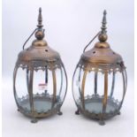 A pair of modern bronzed metal hanging lanterns, h.39cm