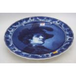 A 20th century Delft charger, decorated with a renaissance style gentleman, dia.42cm