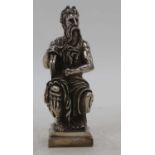 A silver clad model of a bearded gentleman, shown in seated pose, stamped 925 to the reverse, h.18cm