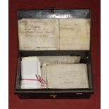 A collection of 19th century and later legal documents, housed in a vintage document box