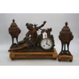A 19th century figural spelter mantel clock garniture, the enamelled dial showing Arabic numerals,