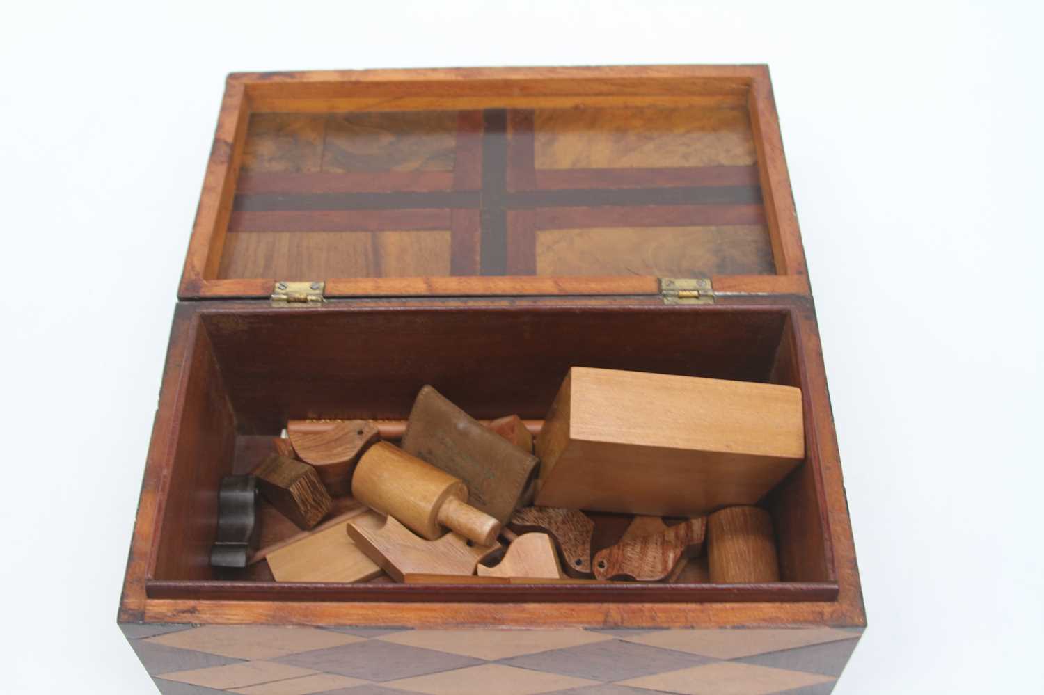 A 19th century parquetry inlaid box, with hinged lid, containing a collection of treen, width 22cm - Image 2 of 3