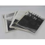 A collection of black and white printed photographs, to include architectural and topographical